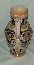 Load image into Gallery viewer, E25 Vintage West Germany Ceramic Relief Pitcher Cherub Floral Design 9.5” Ta
