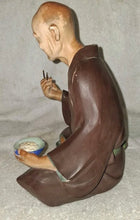 Load image into Gallery viewer, Vintage Hakata Urasaki Doll Japan Seated Man Eating Chopsticks Clay Figurine 9"
