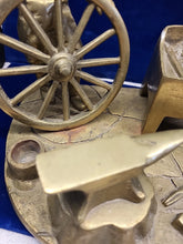 Load image into Gallery viewer, Vintage Brass Sculpture of a Blacksmith with A Wagon Wheel
